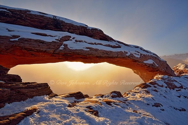Mesa Arch in winter, with morning fog, Canyonlands National Park, Utah, USA